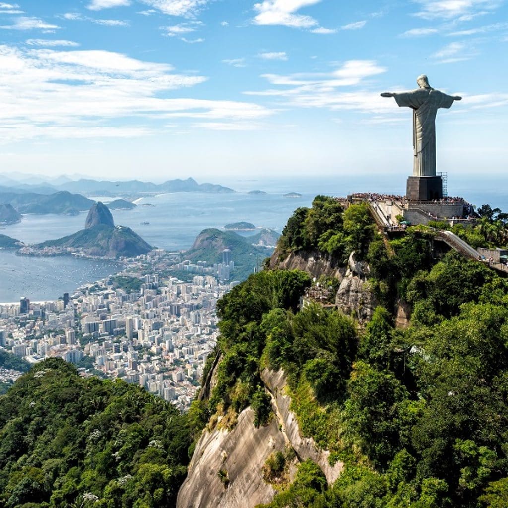 Aerial view of Christ Statue on Corcovado Hill overlooking skyline of Rio de Janeiro, Brazil. One of the world most popular landmark