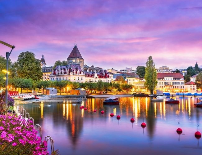 Lausanne, Switzerland from the Ouchy Promenade on Lake Leman at twilight.