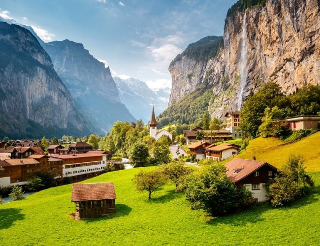 Summer view of alpine valley of Lauterbrunnen, Location place Swiss alp, Bernese Oberland, Europe Staubbach waterfall is a famous tourist attraction Natural wallpaper Discover the world of beauty
